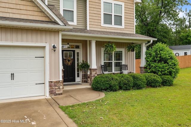 456 N Prince Henry Way, Cameron, NC 28326 - view of exterior entry with a porch, a yard, stone siding, and board and batten siding