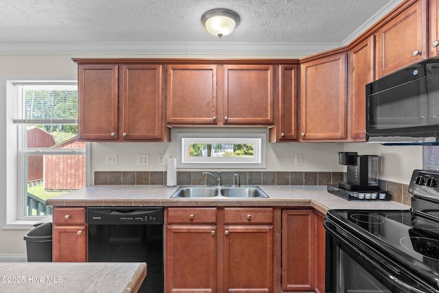 233 NE 70th St, Oak Island, NC 28465 - kitchen with black appliances, a sink, a textured ceiling, ornamental molding, and brown cabinets