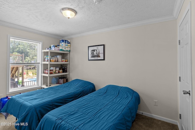 233 NE 70th St, Oak Island, NC 28465 - bedroom with carpet, ornamental molding, a textured ceiling, and baseboards