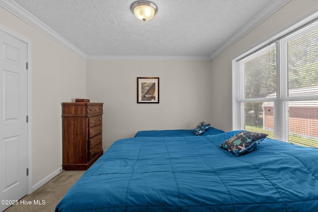 233 NE 70th St, Oak Island, NC 28465 - bedroom featuring carpet floors, a textured ceiling, crown molding, and baseboards