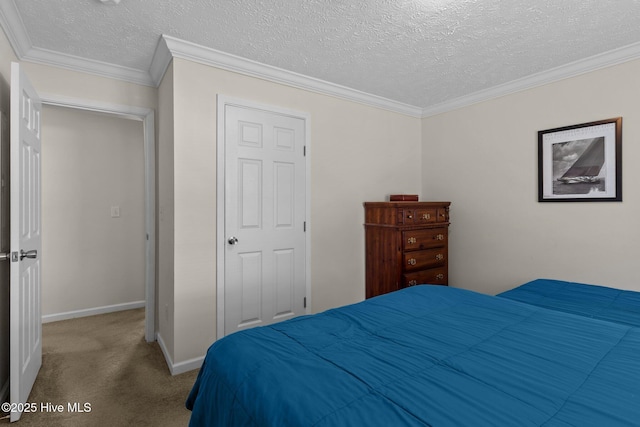 233 NE 70th St, Oak Island, NC 28465 - carpeted bedroom featuring baseboards, a textured ceiling, and crown molding