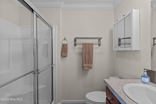 233 NE 70th St, Oak Island, NC 28465 - bathroom featuring crown molding, vanity, an enclosed shower, toilet, and baseboards