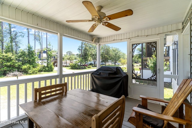 233 NE 70th St, Oak Island, NC 28465 - sunroom with a ceiling fan, healthy amount of natural light, and outdoor dining area