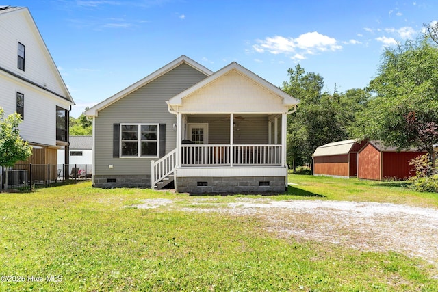 233 NE 70th St, Oak Island, NC 28465 - view of front of property featuring crawl space, a sunroom, and central air condition unit