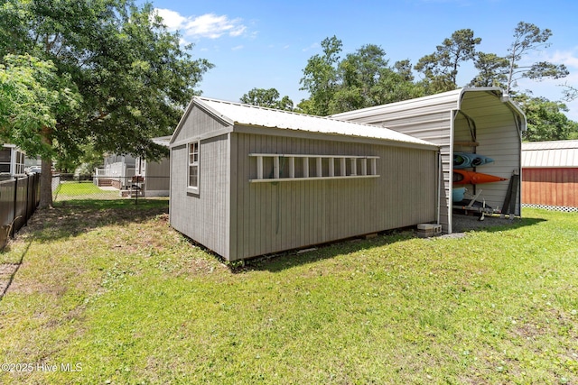 233 NE 70th St, Oak Island, NC 28465 - view of outbuilding with a detached carport