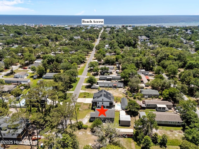 233 NE 70th St, Oak Island, NC 28465 - aerial perspective of suburban area featuring a large body of water and a tree filled landscape