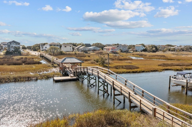 233 NE 70th St, Oak Island, NC 28465 - dock area featuring a water view