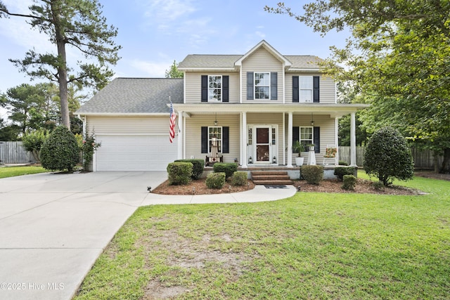 130 Combine Ln, Leland, NC 28451 - colonial house featuring covered porch, a garage, concrete driveway, and roof with shingles
