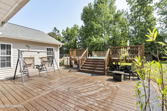 130 Combine Ln, Leland, NC 28451 - deck featuring a fire pit and stairway