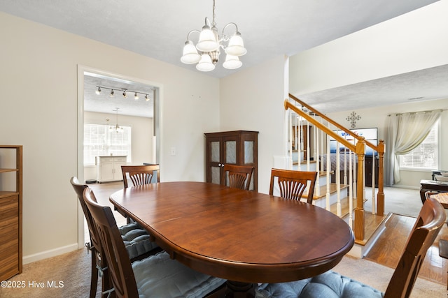 130 Combine Ln, Leland, NC 28451 - dining space featuring a chandelier, light carpet, and healthy amount of natural light