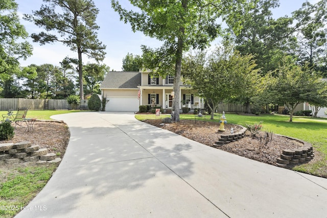 130 Combine Ln, Leland, NC 28451 - view of front facade featuring driveway, a porch, and an attached garage