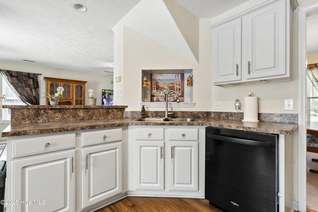 130 Combine Ln, Leland, NC 28451 - kitchen featuring dishwasher, a sink, dark countertops, white cabinets, and wood finished floors