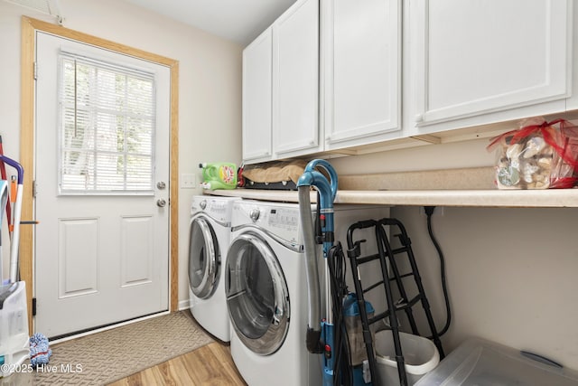 130 Combine Ln, Leland, NC 28451 - laundry area with washer and clothes dryer, light wood-style flooring, and cabinet space