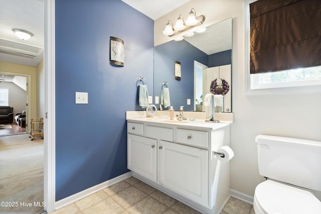 130 Combine Ln, Leland, NC 28451 - bathroom with vanity, toilet, and baseboards