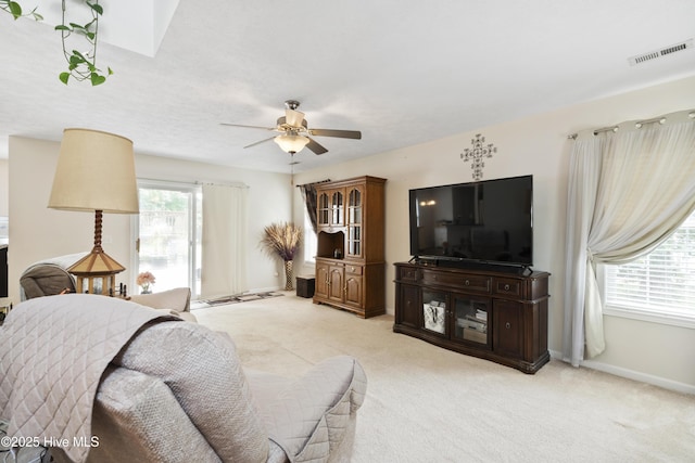 130 Combine Ln, Leland, NC 28451 - living area featuring a ceiling fan, light carpet, and baseboards