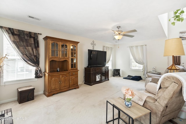 130 Combine Ln, Leland, NC 28451 - living area featuring light colored carpet, a ceiling fan, and baseboards