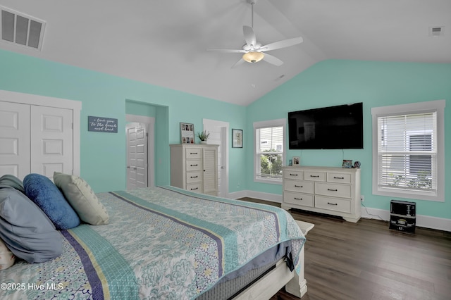 557 Moss Lake Ln, Holly Ridge, NC 28445 - bedroom with vaulted ceiling, dark wood finished floors, baseboards, a ceiling fan, and a closet