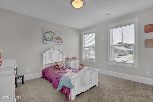 557 Moss Lake Ln, Holly Ridge, NC 28445 - bedroom with carpet floors and baseboards