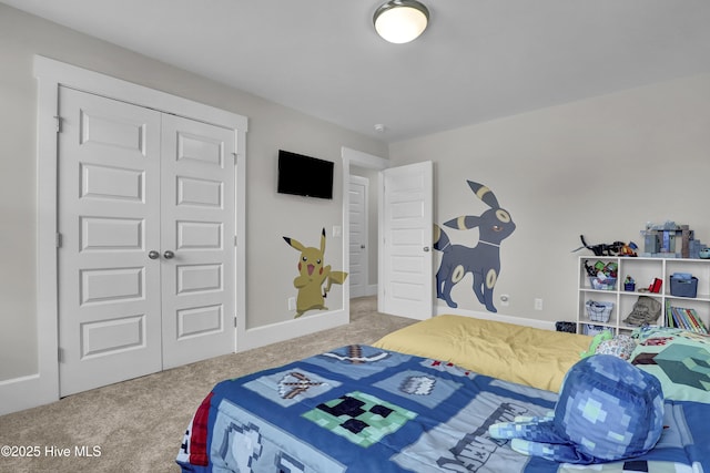 557 Moss Lake Ln, Holly Ridge, NC 28445 - bedroom with carpet flooring, a closet, and baseboards