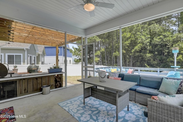 557 Moss Lake Ln, Holly Ridge, NC 28445 - sunroom with an outdoor hangout area, a ceiling fan, and plenty of natural light