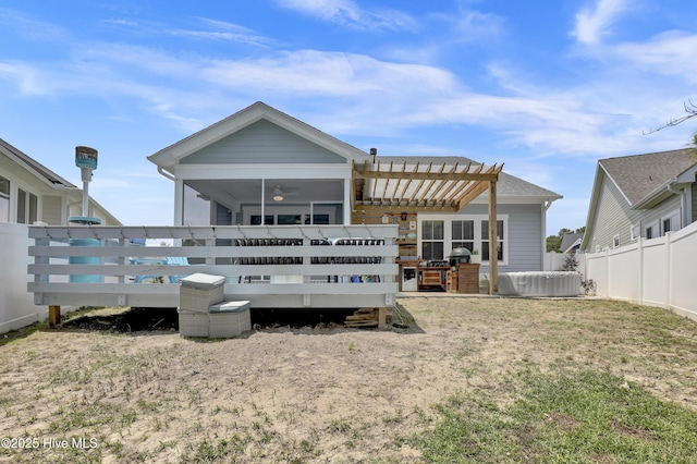 557 Moss Lake Ln, Holly Ridge, NC 28445 - back of house featuring a wooden deck, a pergola, and a sunroom