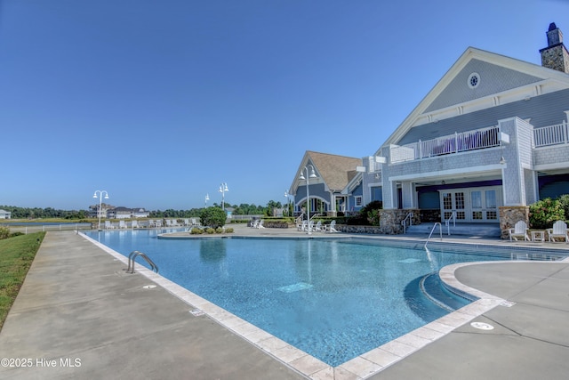 557 Moss Lake Ln, Holly Ridge, NC 28445 - community pool with french doors and a patio area