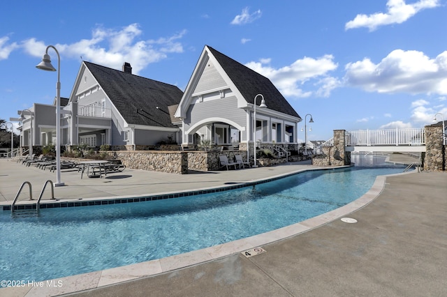 557 Moss Lake Ln, Holly Ridge, NC 28445 - community pool with a patio