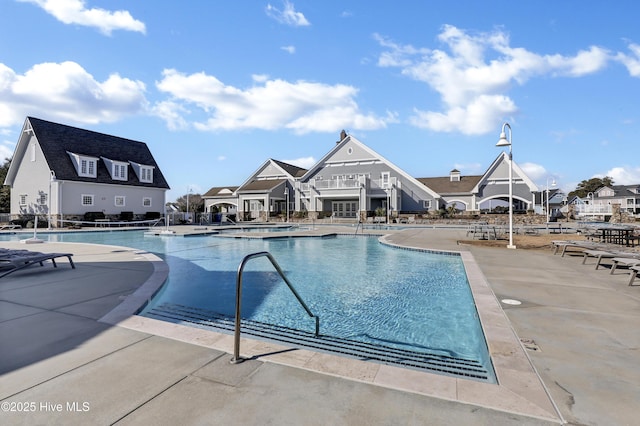 557 Moss Lake Ln, Holly Ridge, NC 28445 - community pool featuring a patio area