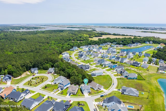 557 Moss Lake Ln, Holly Ridge, NC 28445 - aerial view of residential area with a large body of water and a forest