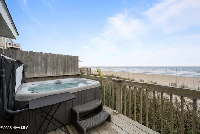 232 Seashore Dr, North Topsail Beach, NC 28460 - wooden deck featuring a hot tub and view of water and beach