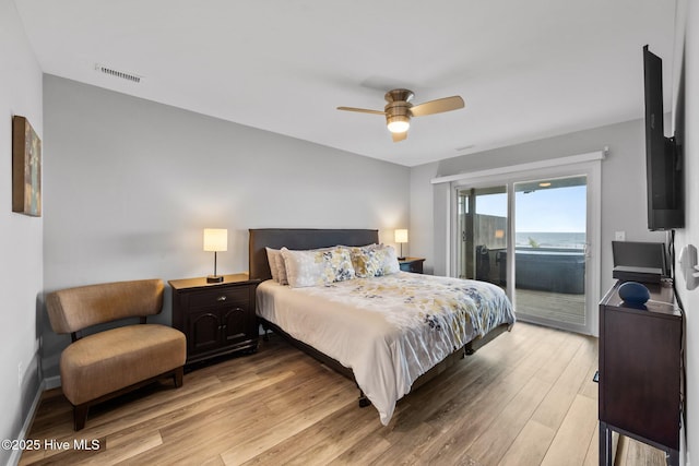 232 Seashore Dr, North Topsail Beach, NC 28460 - bedroom featuring access to exterior, light wood finished floors, a ceiling fan, and baseboards