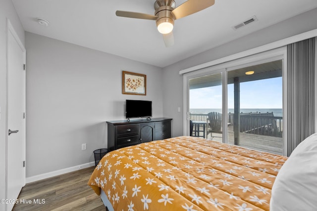 232 Seashore Dr, North Topsail Beach, NC 28460 - bedroom featuring access to outside, wood finished floors, and baseboards