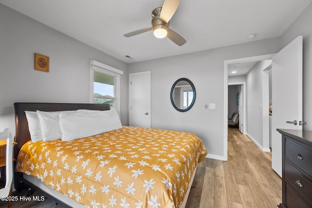 232 Seashore Dr, North Topsail Beach, NC 28460 - bedroom featuring light wood-style floors, baseboards, and ceiling fan