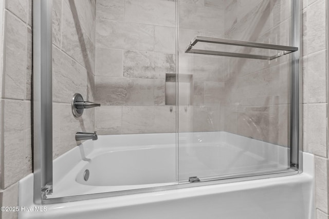 232 Seashore Dr, North Topsail Beach, NC 28460 - bathroom featuring combined bath / shower with glass door