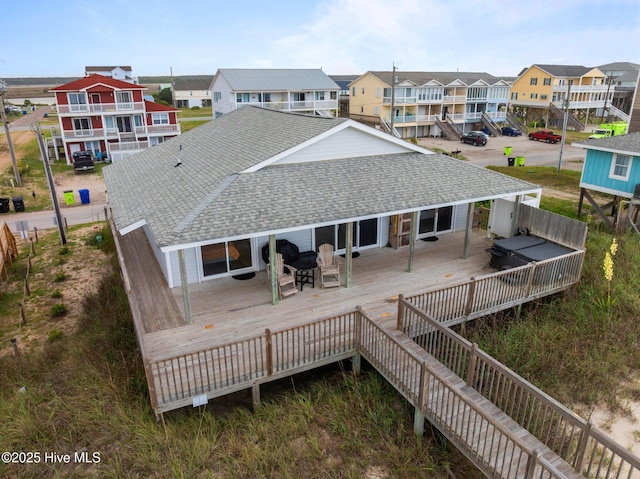 232 Seashore Dr, North Topsail Beach, NC 28460 - rear view of house with a shingled roof, a wooden deck, and a residential view