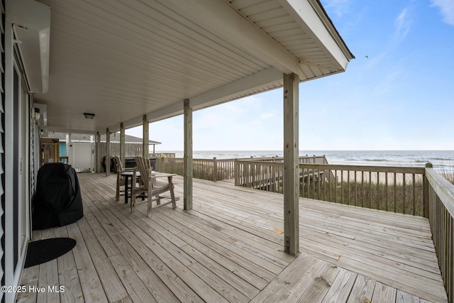 232 Seashore Dr, North Topsail Beach, NC 28460 - wooden terrace with view of water and beach and a grill