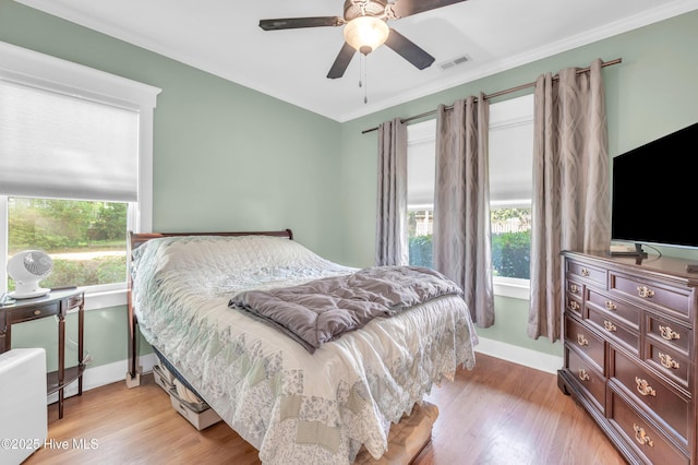 2013 Adams St, Wilmington, NC 28401 - bedroom featuring light wood-style flooring, ceiling fan, ornamental molding, and baseboards