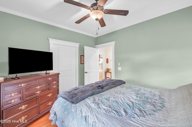 2013 Adams St, Wilmington, NC 28401 - bedroom with ornamental molding, light wood finished floors, and a ceiling fan