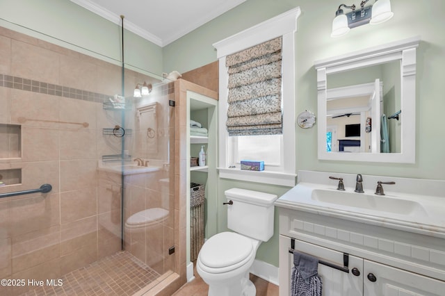 2013 Adams St, Wilmington, NC 28401 - bathroom featuring a stall shower, toilet, ornamental molding, and vanity