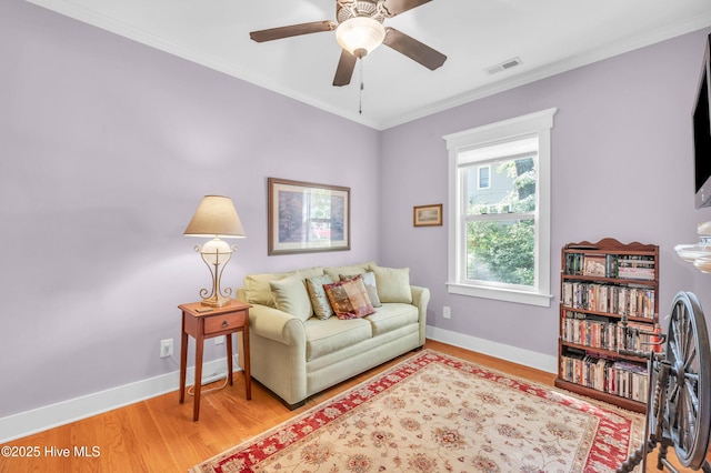 2013 Adams St, Wilmington, NC 28401 - living area with light wood finished floors, baseboards, crown molding, and ceiling fan
