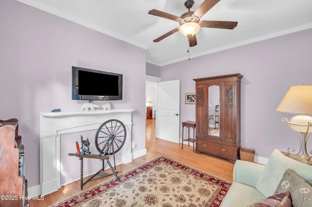 2013 Adams St, Wilmington, NC 28401 - living room with a ceiling fan, crown molding, wood finished floors, and baseboards