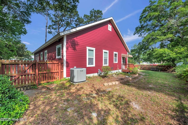 2013 Adams St, Wilmington, NC 28401 - view of side of property with central AC unit and a deck
