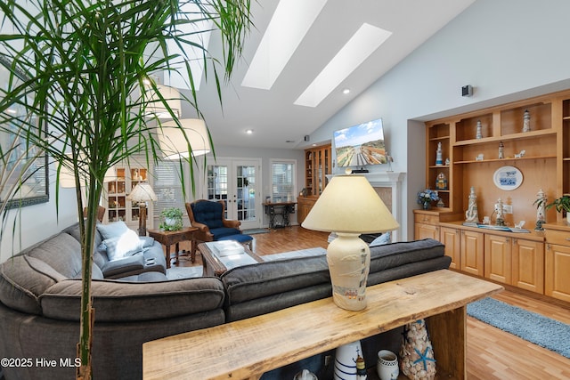 4 Golf Crest Ct, Carolina Shores, NC 28467 - living area with high vaulted ceiling, a skylight, light wood-type flooring, and recessed lighting