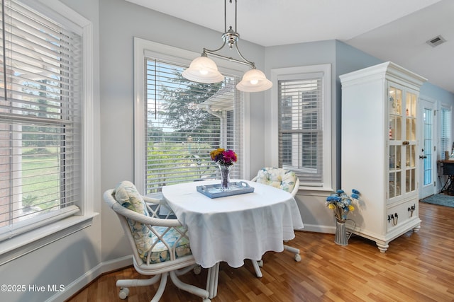 4 Golf Crest Ct, Carolina Shores, NC 28467 - dining area with light wood-style flooring and baseboards