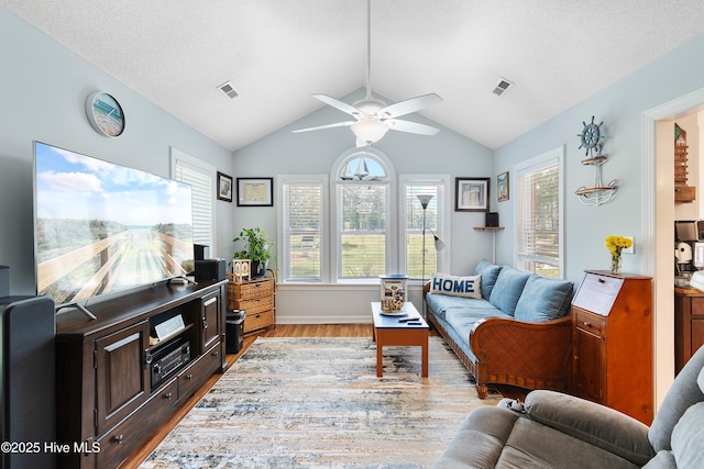 4 Golf Crest Ct, Carolina Shores, NC 28467 - living room with wood finished floors, a ceiling fan, vaulted ceiling, and baseboards