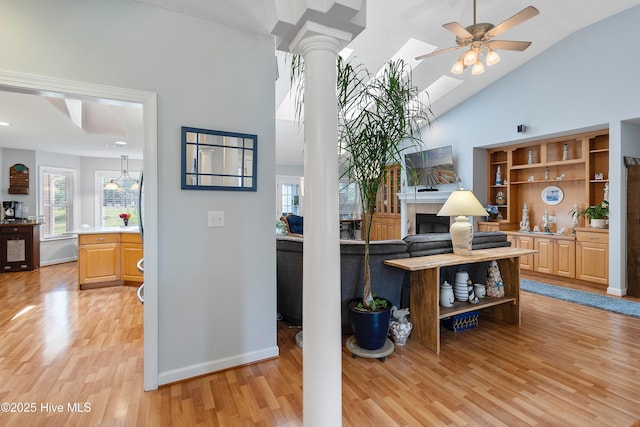 4 Golf Crest Ct, Carolina Shores, NC 28467 - office with light wood finished floors, a ceiling fan, high vaulted ceiling, ornate columns, and a skylight