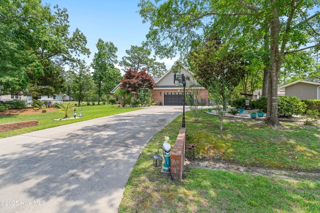 4 Golf Crest Ct, Carolina Shores, NC 28467 - view of front of home with concrete driveway, brick siding, and a front yard