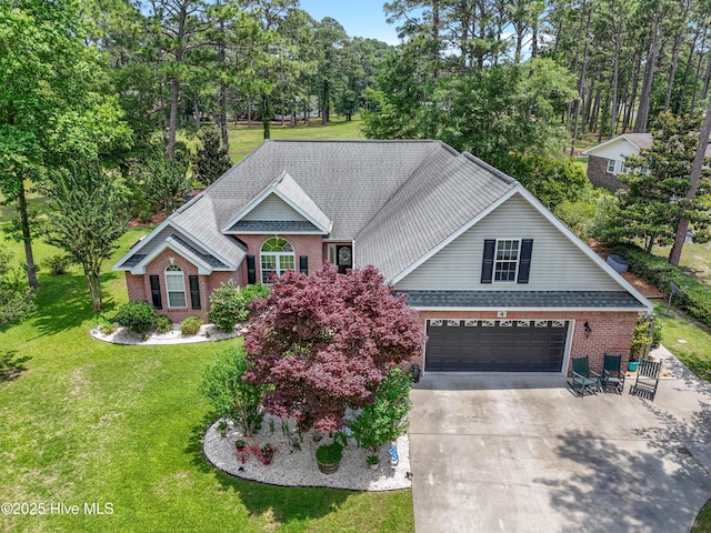 4 Golf Crest Ct, Carolina Shores, NC 28467 - traditional-style house with brick siding, driveway, a garage, a front lawn, and a shingled roof