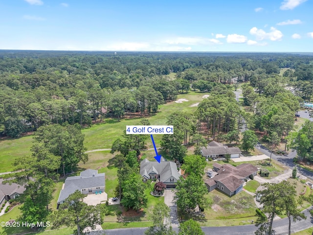 4 Golf Crest Ct, Carolina Shores, NC 28467 - aerial perspective of suburban area with a forest