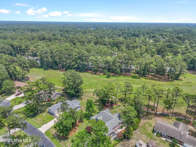 4 Golf Crest Ct, Carolina Shores, NC 28467 - aerial view of property and surrounding area featuring a forest